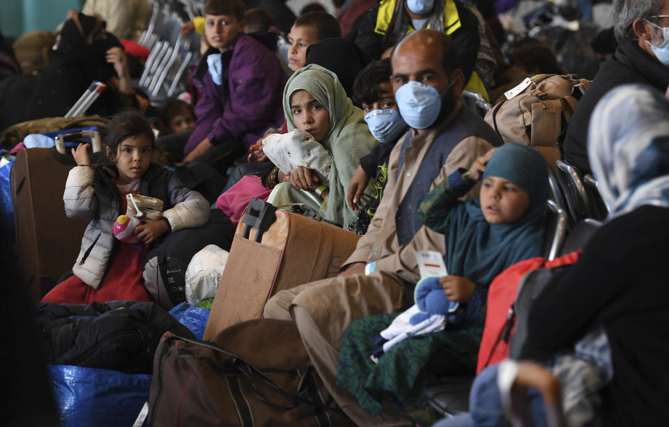 Afghan refugees are processed inside Hangar 5 at the Ramstein U.S. Air Base in Germany Wednesday, Sept. 8, 2021. U.S. Secretary of State Antony Blinken arrived at the base where he will meet with his German counterpart for talks on Afghanistan. (Olivier Douliery/Pool Photo via AP)