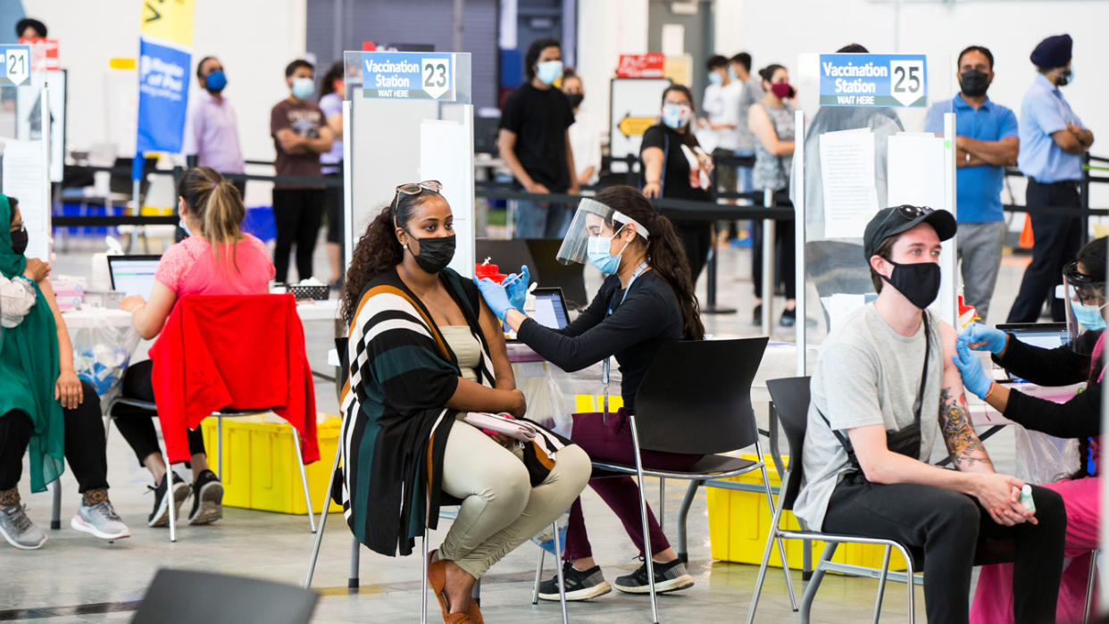 Vaccinations are administered at a clinic at Save Max Sports Center in Brampton, Ontario, Canada, last weekend.