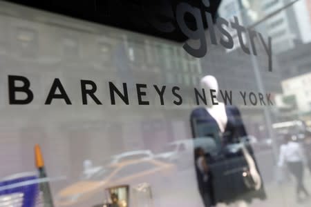 FILE PHOTO: The Barneys New York sign is seen in a display window outside the luxury department store in New York