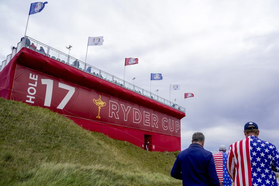 Fans walk on the 17th hole during a practice day at the Ryder Cup at the Whistling Straits Golf Course Thursday, Sept. 23, 2021, in Sheboygan, Wis. (AP Photo/Jeff Roberson)