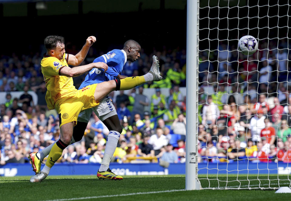 Everton's Abdoulaye Doucoure scores his side's first goal of the game, during the English Premier League soccer match between Everton and Sheffield United, at Goodison Park, in Liverpool, England, Saturday May 11, 2024. (Peter Byrne/PA via AP)