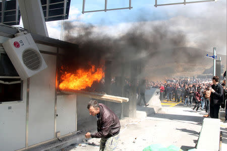 Protesters set toll booths on fire on the Durres-Kukes highway in Kalimash near Kukes, Albania March 31, 2018. REUTERS/Stringer