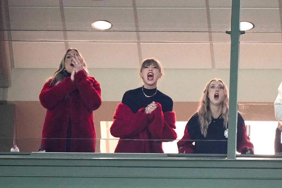 Taylor Swift, center, cheers during the second half of an NFL football game between the Kansas City Chiefs and Green Bay Packers, Sunday, Dec. 3, 2023 in Green Bay, Wis. (AP Photo/Morry Gash)