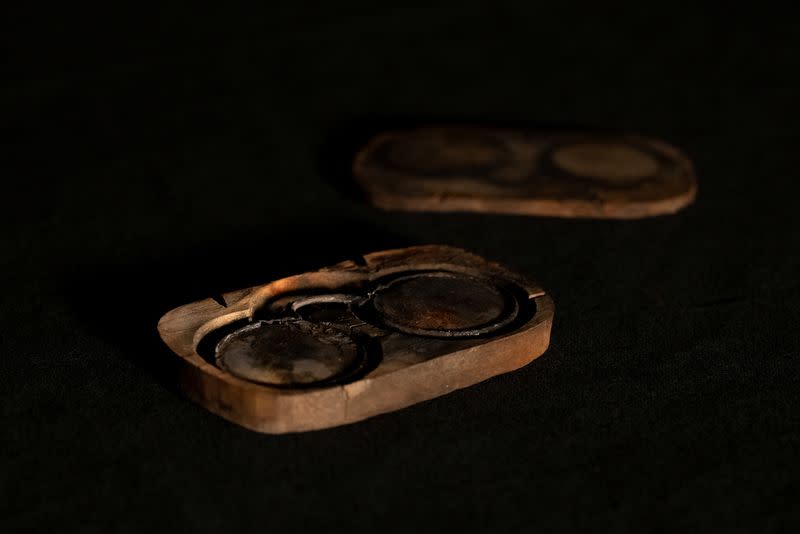 A case with glasses recovered from the shipwreck of The Gloucester is displayed after the royal warship discovered off the coast of Norfolk