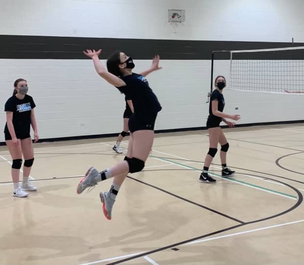 Players on the U15 Blue team of the Vision Elite Volleyball Club during a practice. 