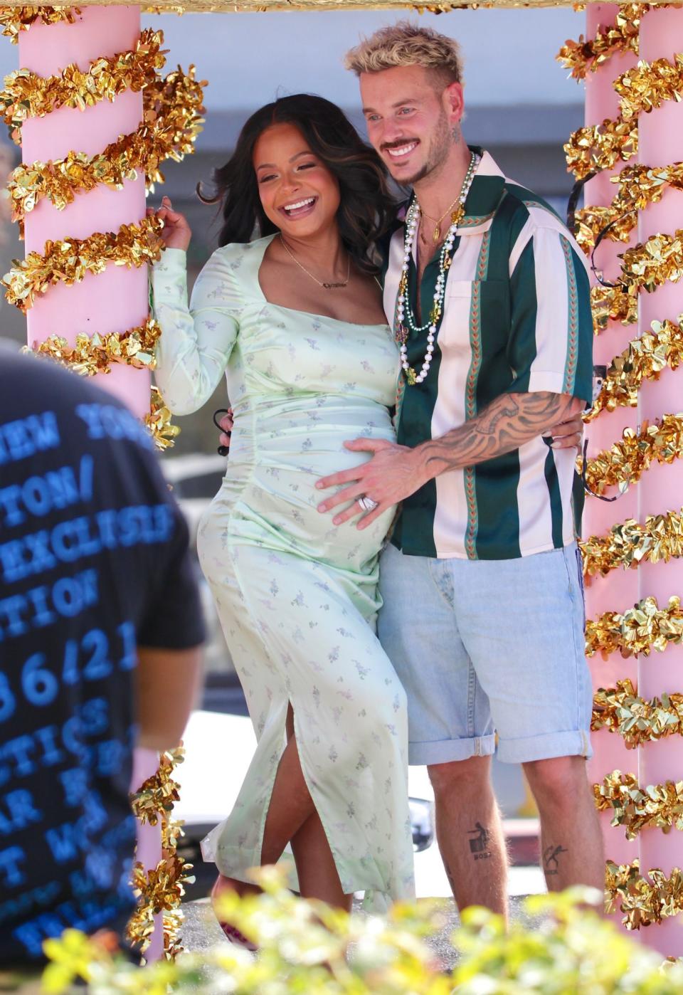   <p>Pregnant Christina Milian and boyfriend Matt Pokora share a happy momoent from atop a parade float in L.A. while promoting her new food venture, Beignet Box. </p>