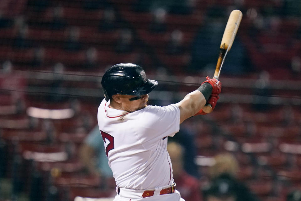 Boston Red Sox's Christian Vazquez follows through on his RBI double during the sixth inning of a baseball game against the Detroit Tigers at Fenway Park, Tuesday, May 4, 2021, in Boston. (AP Photo/Charles Krupa)
