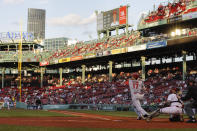 Los Angeles Angels' Shohei Ohtani follows through on a double against the Boston Red Sox during the first inning of a baseball game Friday, May 14, 2021, at Fenway Park in Boston. (AP Photo/Winslow Townson)