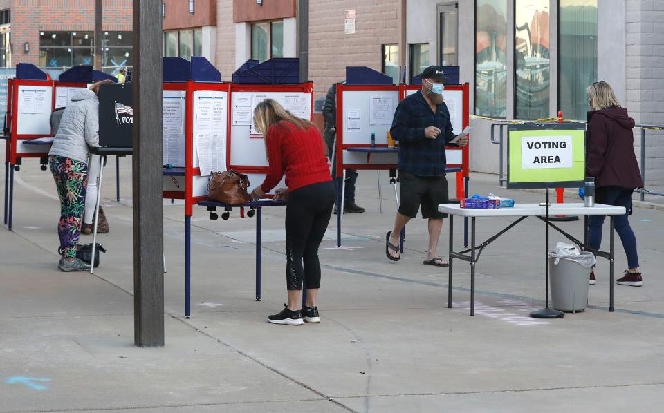 Voters cast their ballots at the Shasta County Elections office in November 2020.