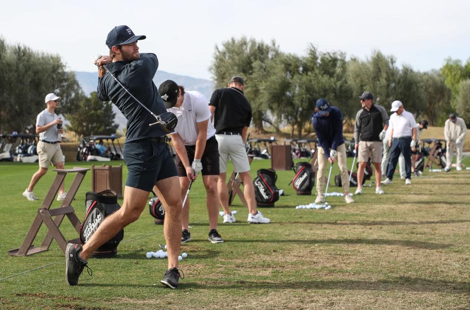 Firebirds player Shane Wright warms up on the range before the start of the Coachella Valley Firebirds Invitational Golf tournament at the Classic Club in Palm Desert, Dec. 4, 2023.