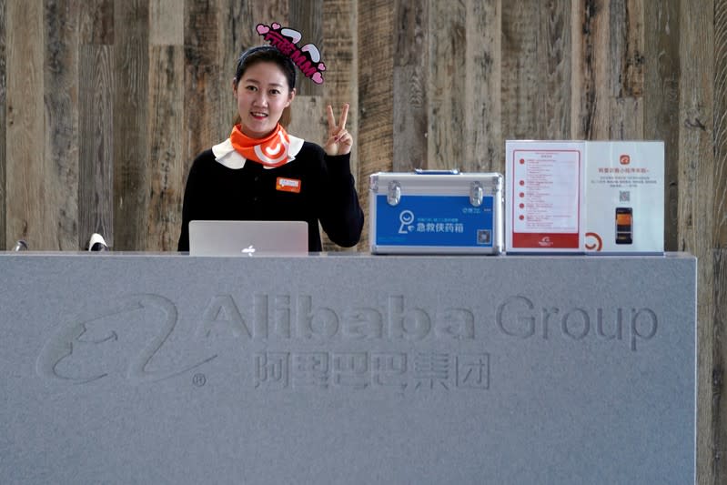 An employee of Alibaba Group gestures during Alibaba Group's 11.11 Singles' Day global shopping festival at the company's headquarters in Hangzhou