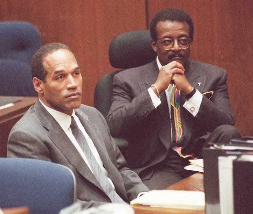 O.J. Simpson, left, and attorney Johnnie Cochran Jr. listen to Judge Lance Ito moments after the prosecution rested its case during Simpson's murder trial in Los Angeles. The prosecution finished after nearly six months of testimony from 58 witnesses in its case against Simpson who was accused of murdering his ex-wife, Nicole Brown Simpson, and Ron Goldman.