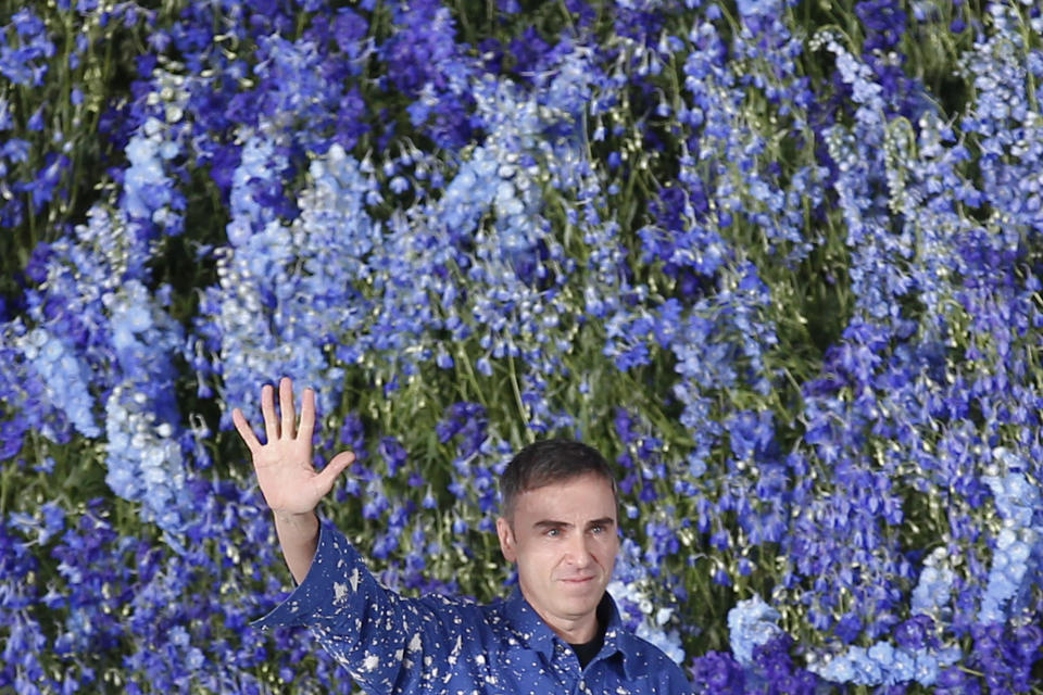 FILE - In this Friday Oct. 2, 2015 file photo Belgian fashion designer Raf Simons acknowledges applause after the presentation of Christian Dior's Spring-Summer 2016 ready-to-wear fashion collection, presented during the Paris Fashion Week in Paris. Miuccia Prada and Raf Simons are entering in a creative design collaboration at Prada going forward indefinitely, the designers announced Sunday, Feb. 23, 2020 at a press conference on the sidelines of Milan Fashion Week. (AP Photo/Francois Mori, file )