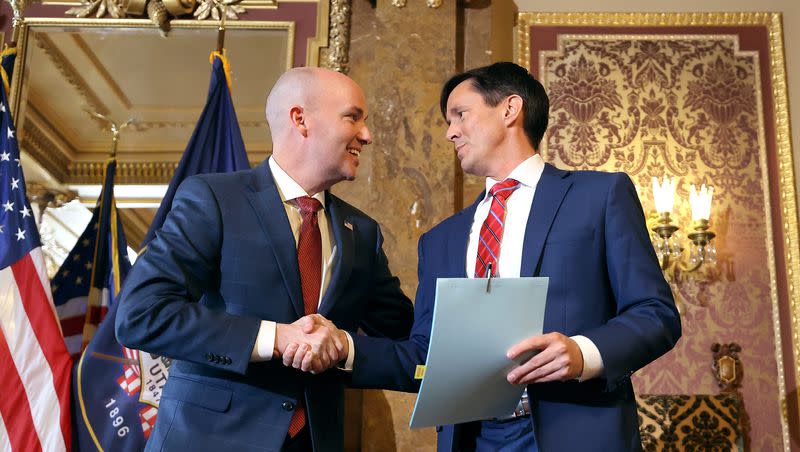 Gov. Spencer Cox shakes hands with Sen. Kirk Cullimore, R-Draper, after signing HB311, Social Media Usage Amendments, which Cullimore sponsored, at the Capitol in Salt Lake City on March 23, 2023.