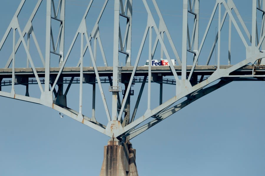 A Federal Express crosses the Francis Scott Key Bridge in Baltimore, Maryland, on October 14, 2021. (Photo by BRENDAN SMIALOWSKI/AFP via Getty Images)