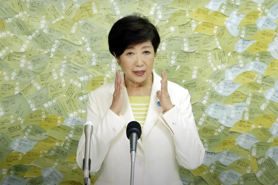 In this image made from YouTube provided by Koike Yuriko Official Channel, Tokyo Gov. Koike speaks on her gubernatorial election victory at her election office in Tokyo, Sunday, July 5, 2020. Koike has won a second term to head the Japanese capital. (Koike Yuriko Official Channel via AP)