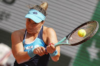 Montenegro's Danka Kovinic plays a shot against Poland's Iga Swiatek during their third round match at the French Open tennis tournament in Roland Garros stadium in Paris, France, Saturday, May 28, 2022. (AP Photo/Michel Euler)