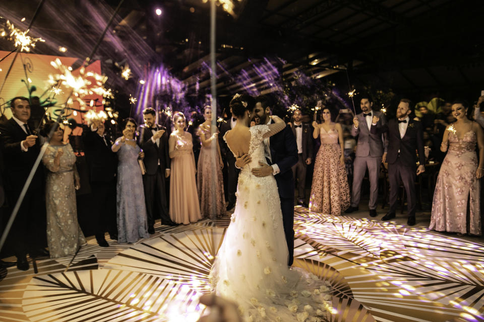 A bride and groom dancing.