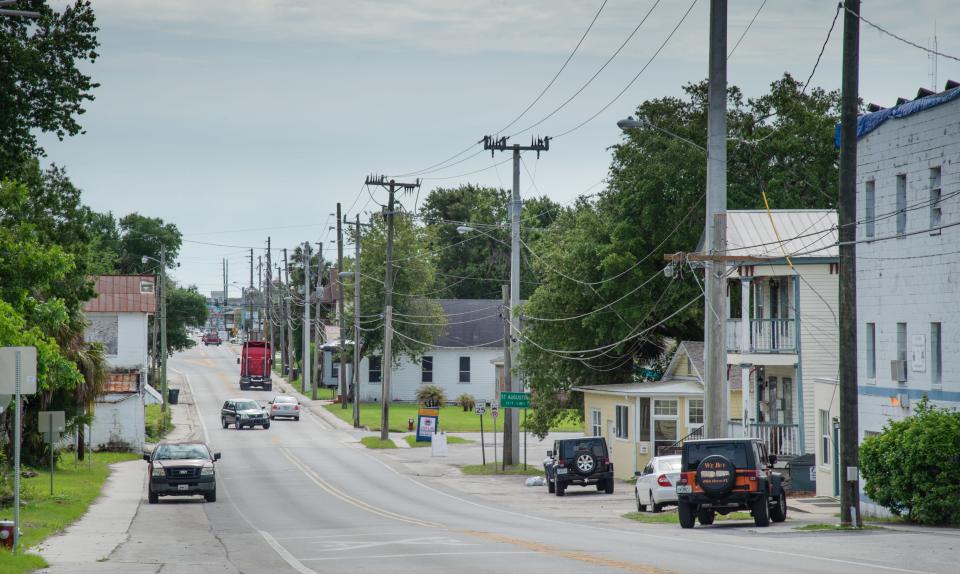 Vehicles travel West King Street in West Augustine in 2018.