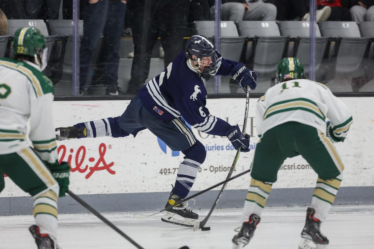 Burrillville's Patrick Murphy handles the puck against Hendricken in Sunday's Division I title matchup.