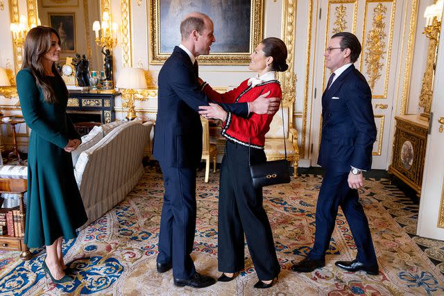 <p>Alamy</p> Kate Middleton and Prince William welcome Princess Victoria and Prince Daniel to Windsor Castle on Nov. 30.