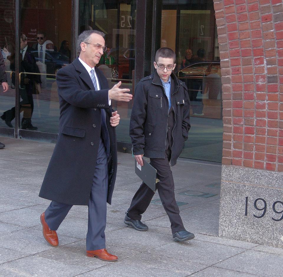 Eighth-grader Liam Morrison of Middleboro, Massachusetts, right, leaves the courthouse with his attorney, David Cortman of the Alliance Defending Freedom, following oral arguments in the U.S. Court of Appeals for the First Circuit in Boston on Thursday morning, Feb. 8, 2024. Morrison is appealing a lower court ruling that said he does not have a First Amendment right to wear a "There are only two genders" T-shirt to school.