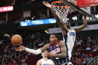 Houston Rockets guard Kevin Porter Jr. passes the ball as Orlando Magic center Mo Bamba (5) defends during the first half of an NBA basketball game Friday, Dec. 3, 2021, in Houston. (AP Photo/Eric Christian Smith)