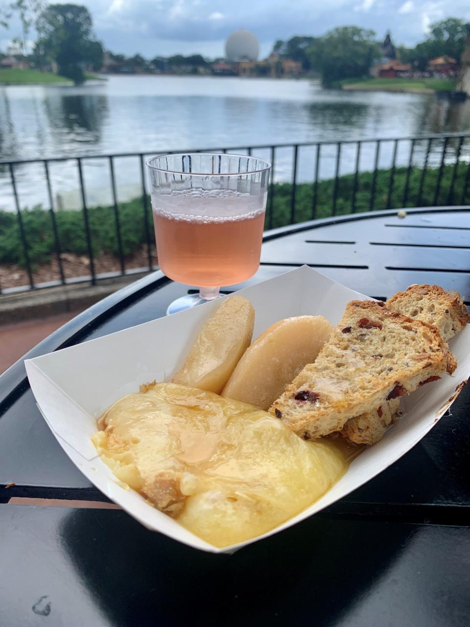 Warm raclette Swiss cheese with Riesling-poached pears, red wine-braised figs, candied pecans, honey and cranberry Toast was one of the dishes at the Alps Kitchen at the EPCOT International Food & Wine Festival. It paired perfectly with a Cave de la Cote Rose Gamay.