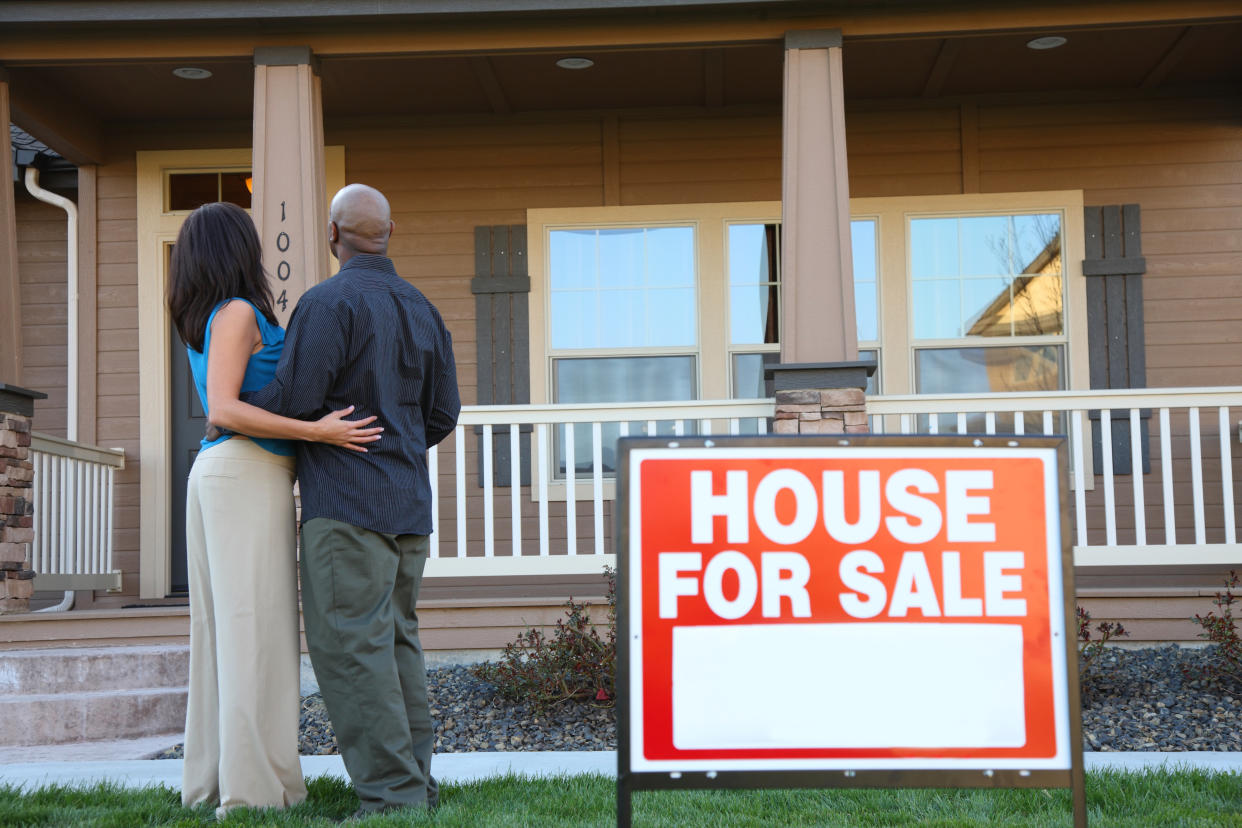 An African American couple looks at a new home together. (Getty Images)