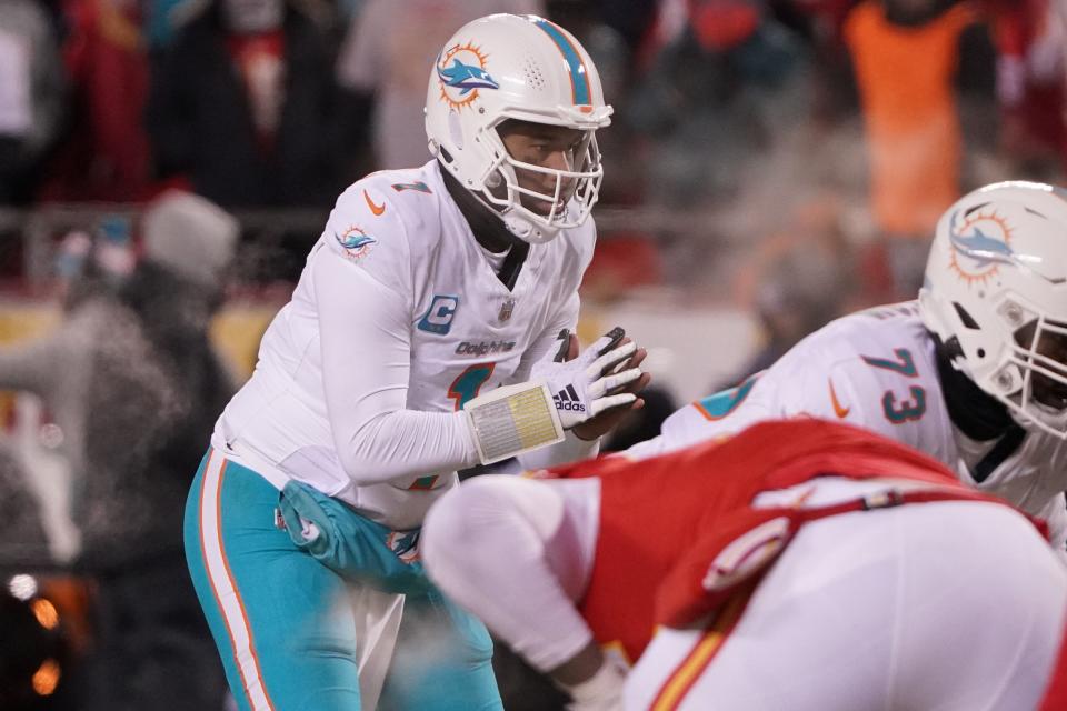 Jan 13, 2024; Kansas City, Missouri, USA; Miami Dolphins quarterback Tua Tagovailoa (1) before taking the snap against the Kansas City Chiefs during the second half of the 2024 AFC wild card game at GEHA Field at Arrowhead Stadium. Mandatory Credit: Denny Medley-USA TODAY Sports