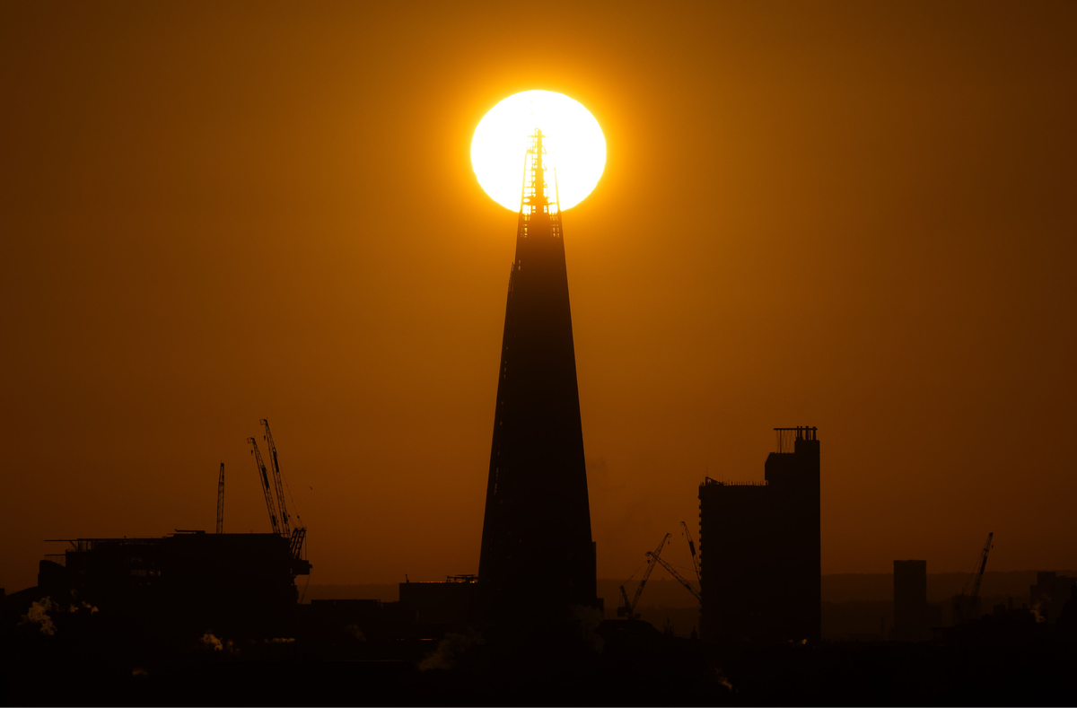 The sun rises behind the Shard skyscraper in London on November 25 (AFP via Getty Images)