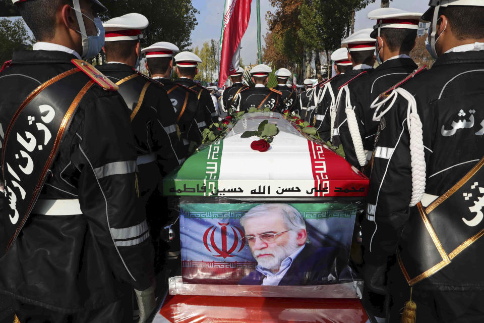 FILE - In this photo released by the official website of the Iranian Defense Ministry, military personnel stand near the flag-draped coffin of Mohsen Fakhrizadeh, a scientist who was killed on Friday, during a funeral ceremony in Tehran, Iran, Monday, Nov. 30, 2020. A court in Iran on Thursday, June 23, 2022 ordered the United States government to pay over $4 billion to the families of Iranian nuclear scientists who have been killed in targeted attacks in recent years, state-run media reported. (Iranian Defense Ministry via AP, File)