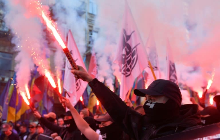 Tens of thousands of far-right activists marched through Kiev, waving red and black flags, a symbol of the nationalist movement