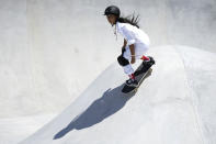 Kokona Hiraki of Japan competes in the women's park skateboarding finals at the 2020 Summer Olympics, Wednesday, Aug. 4, 2021, in Tokyo, Japan. (AP Photo/Ben Curtis)