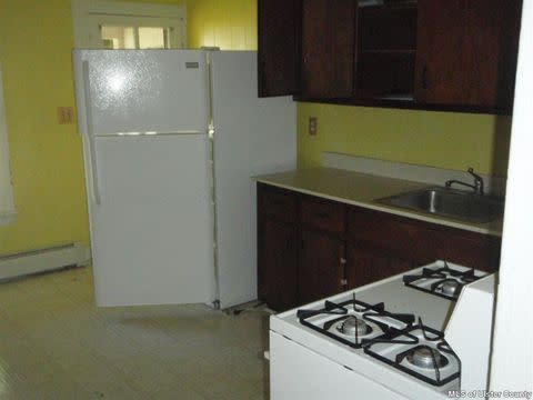 BEFORE: “It was a mess,” Maryline says, of the crowded kitchen layout before, “practically everything had been crammed onto one wall of the kitchen.”