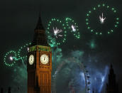 LONDON, ENGLAND - JANUARY 01: Fireworks light up the London skyline and Big Ben just after midnight on January 1, 2012 in London, England. Thousands of people lined the banks of the River Thames in central London to ring in the New Year with a spectacular fireworks display. (Photo by Dan Kitwood/Getty Images)