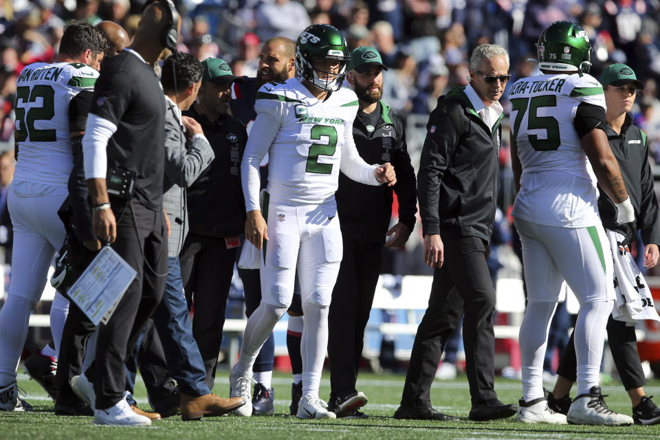 New York Jets quarterback Zach Wilson (2) walks off the field after an injury during the first half of an NFL football game against the New England Patriots, Sunday, Oct. 24, 2021, in Foxborough, Mass. (AP Photo/Stew Milne)