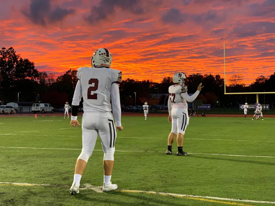 Stroudsburg junior quarterback Ethan Sodl (2) and junior center Xavier Dorst (57) warm up for their game against East Stroudsburg South on Friday, Oct. 16, 2020. The Mounties lost 69-7.