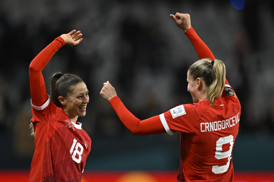 Switzerland's Ana Maria Crnogorcevic, right, celebrates with Switzerland's Viola Calligaris after the Women's World Cup Group A soccer match between New Zealand and Switzerland in Dunedin, New Zealand, Sunday, July 30, 2023. (AP Photo/Andrew Cornaga)