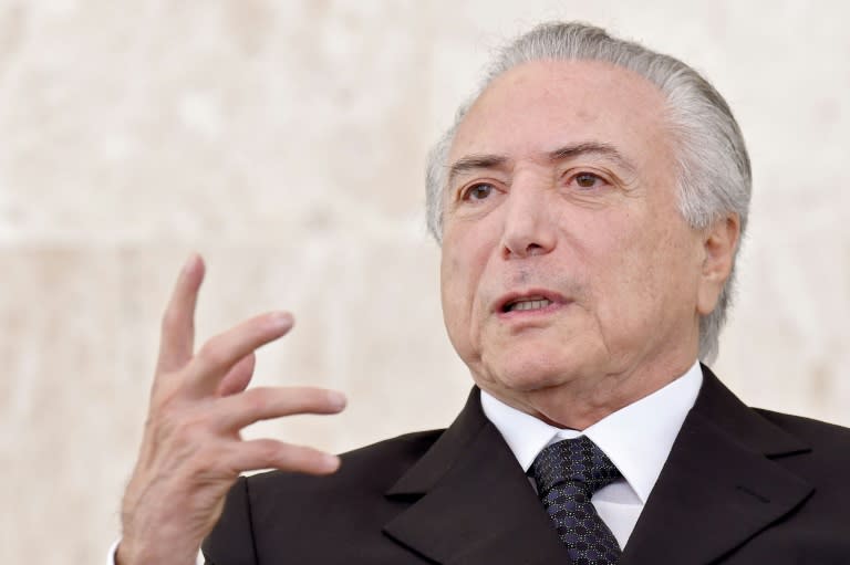 Brazilian acting President Michel Temer gestures during a ceremony of the presentation of credentials of Ambassadors at Planalto Palace in Brasilia on May 25, 2016