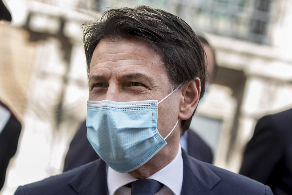 Italian Premier Giuseppe Conte leaves after addressing the Senate, in Rome, Thursday, April 30, 2020. Italy is in its eighth week of national lockdown to cope with COVID-19 emergency with some partial easing of restrictions on everyday life slated to take effect on Monday, with lifting of yet more limits set for later in coming weeks, on condition the rate of contagion doesn’t sharply start rising again. (Roberto Monaldo/LaPresse via AP)