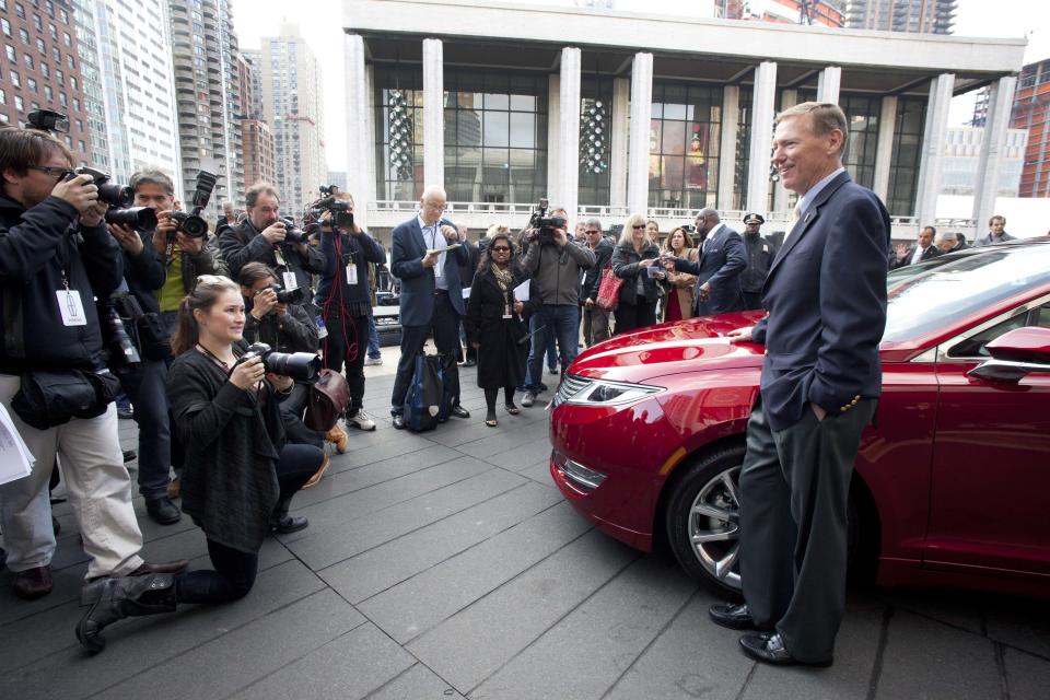 Ford Motor Co. President and CEO Alan Mulally, stands next to a Lincoln MKZ as he poses for photographers, Monday, Dec. 3, 2012 in New York. The MKZ will arrive at dealerships this month. The MKZ is the first of seven new or revamped Lincolns that will go on sale by 2015. (AP Photo/Mark Lennihan)