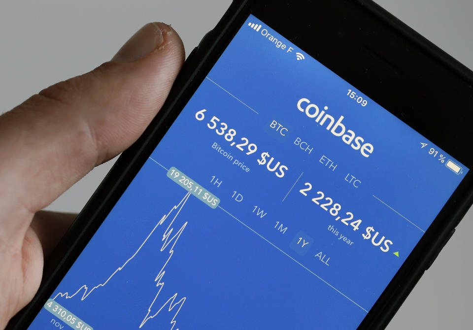 PARIS, FRANCE - OCTOBER 05:  In this photo illustration, the Coinbase cryptocurrency exchange application is seen on the screen of an iPhone on October 05, 2018 in Paris, France. The California cryptocurrency platform is about to raise $ 500 million in the event of an IPO. After having exceeded 20 million users this summer, the cryptocurrency trading platform has seen its financial value further increase. The California start-up is now valued at $ 8 billion.  (Photo Illustration by Chesnot/Getty Images)