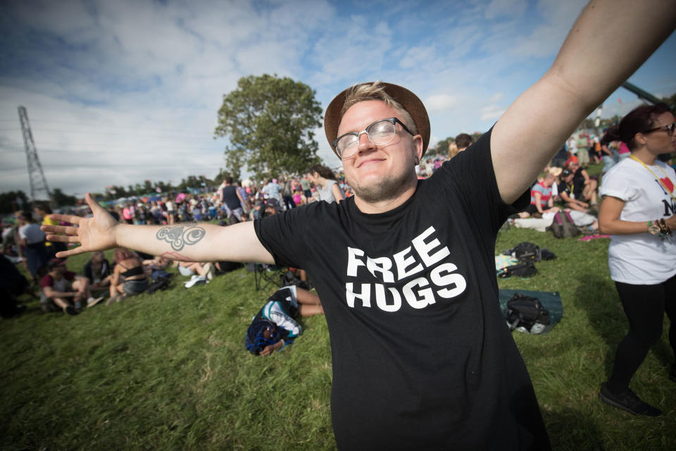 A festival-goer wears a ‘free hugs’ t-shirt