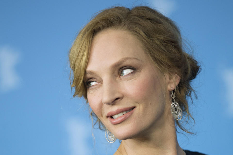 Actress Uma Thurman poses for photographers at the photo call for the film Nymphomaniac at the International Film Festival Berlinale in Berlin, Sunday, Feb. 9, 2014. (AP Photo/Axel Schmidt)