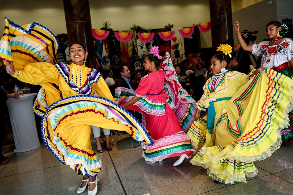 Members of the dance group Ballet Maria Luz perform during a Mexican Independence Day celebration on Friday, Sept. 16, 2022, at city hall in Lansing.