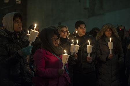 Mourners participate in a candle light vigil for late actor Phillip Seymour Hoffman in the Manhattan borough of New York February 5, 2014. Although Hoffman was found with a syringe in his arm, the cause of his death remained undetermined and more study was needed, said Julie Bolcer, a spokeswoman for New York City's Chief Medical Examiner. REUTERS/Keith Bedford