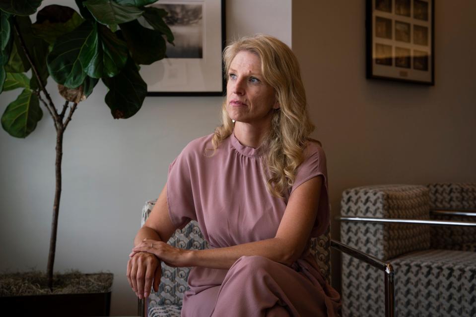 Jaime Nelson-Molnar, 44, of Ann Arbor, sits in her attorney's office in Royal Oak on July 14, 2023. “Anyone should help a child saying ‘help!’ I don’t know how someone has it in their body to hear a child saying help and stand by and watch,” said Nelson-Molnar, whose son with autism was assaulted by a school bus aide when he was 7 years old. Nelson-Molnar is now suing the Ann Arbor Public Schools over the incident.