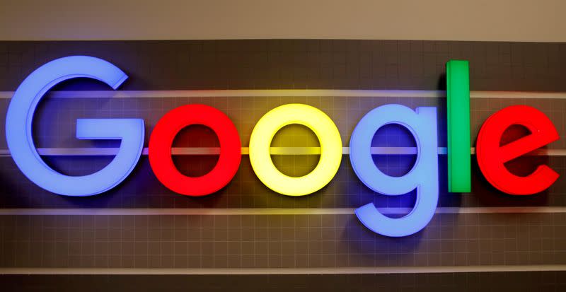 FILE PHOTO: FILE PHOTO: FILE PHOTO: An illuminated Google logo is seen inside an office building in Zurich