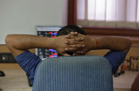 A broker reacts while trading at his computer terminal at a stock brokerage firm in Mumbai, February 26, 2016. REUTERS/Shailesh Andrade/Files